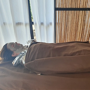 Woman wrapping coffee and essences